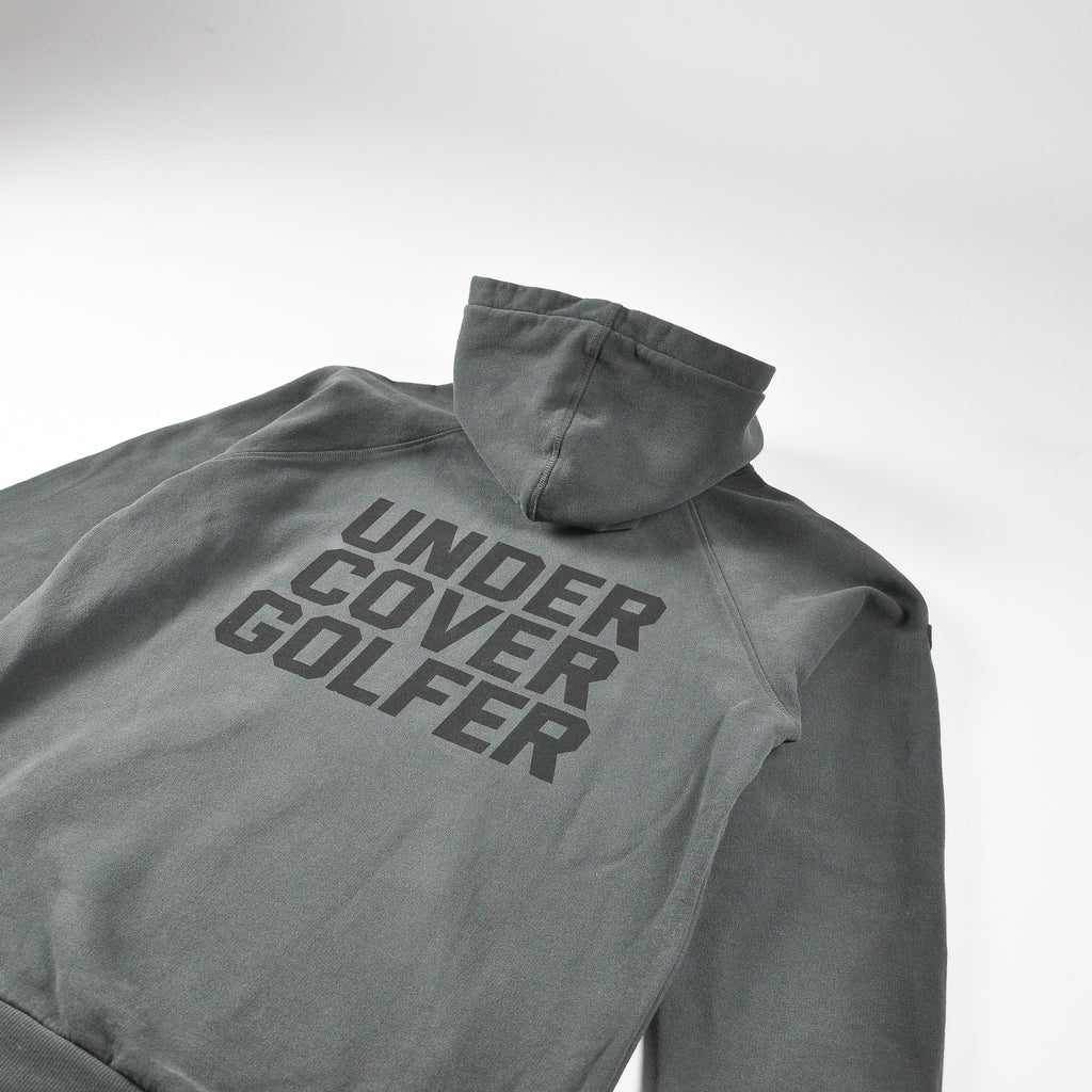 Faded black hoodie with UNDER COVER GOLF print on the back