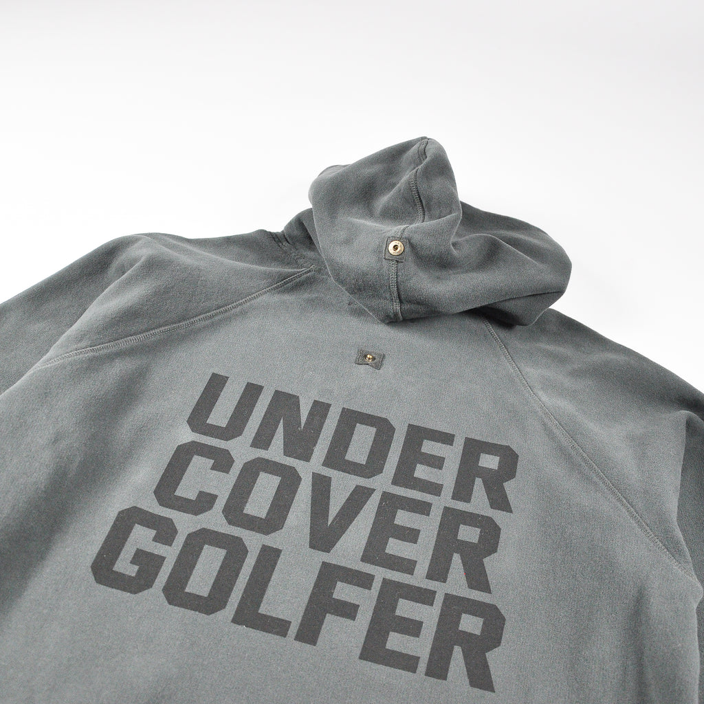 Faded black hoodie with UNDER COVER GOLF print on the back