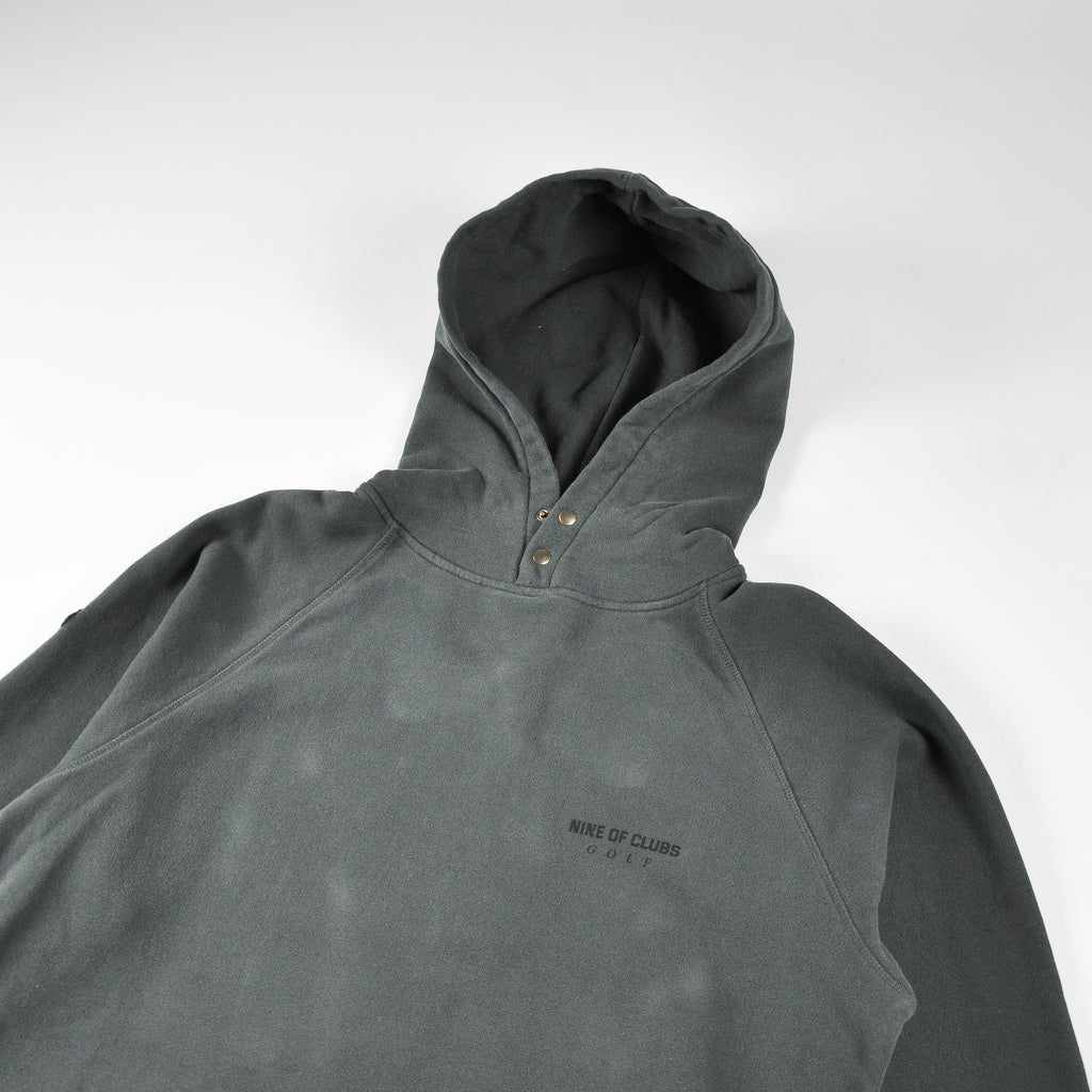Faded black hoodie with UNDER COVER GOLF print on the back